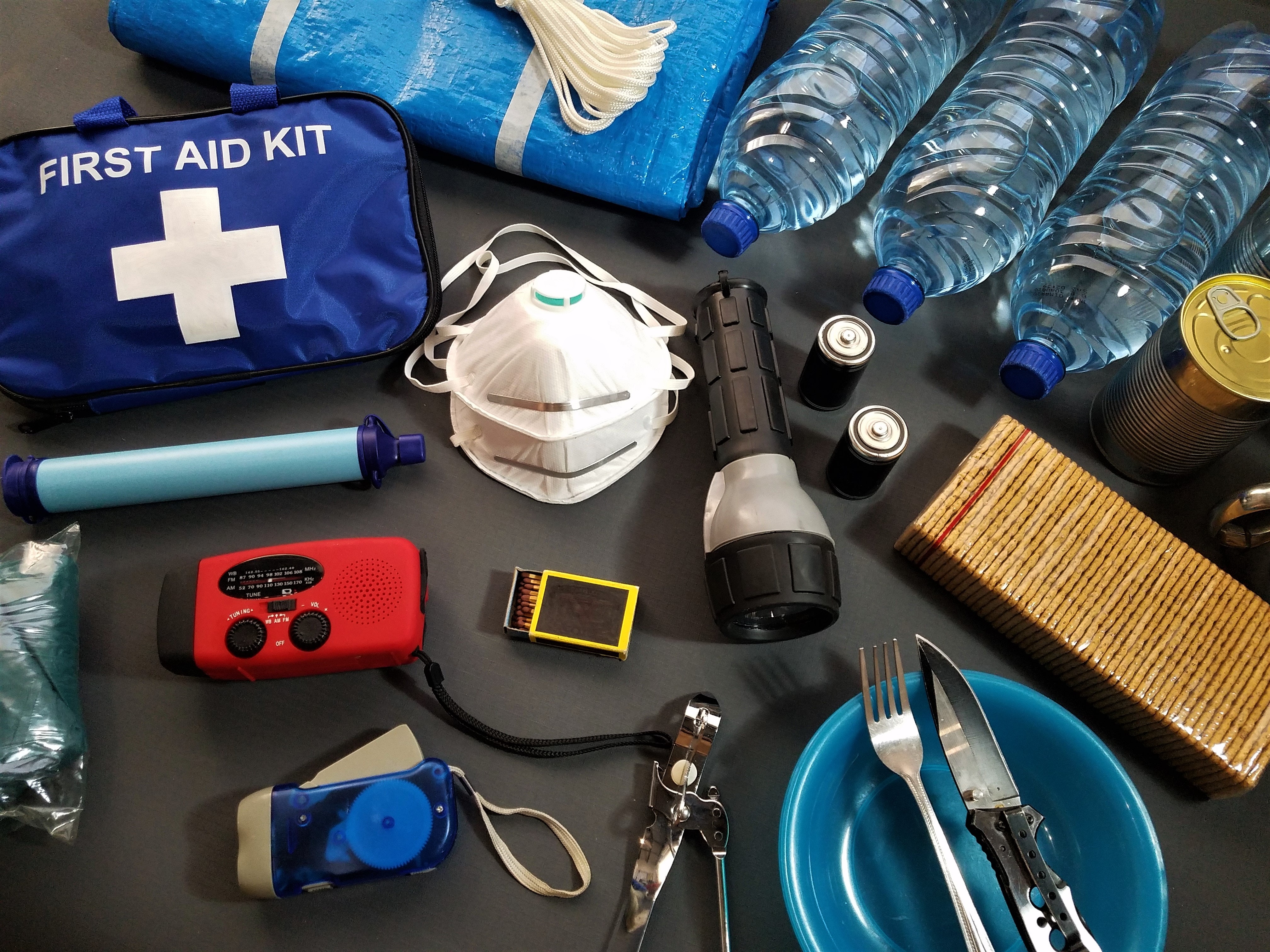 Emergency survival kit on black table 